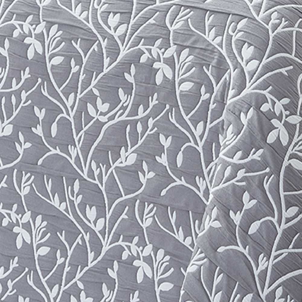 colcha con motivos florales gris reversible