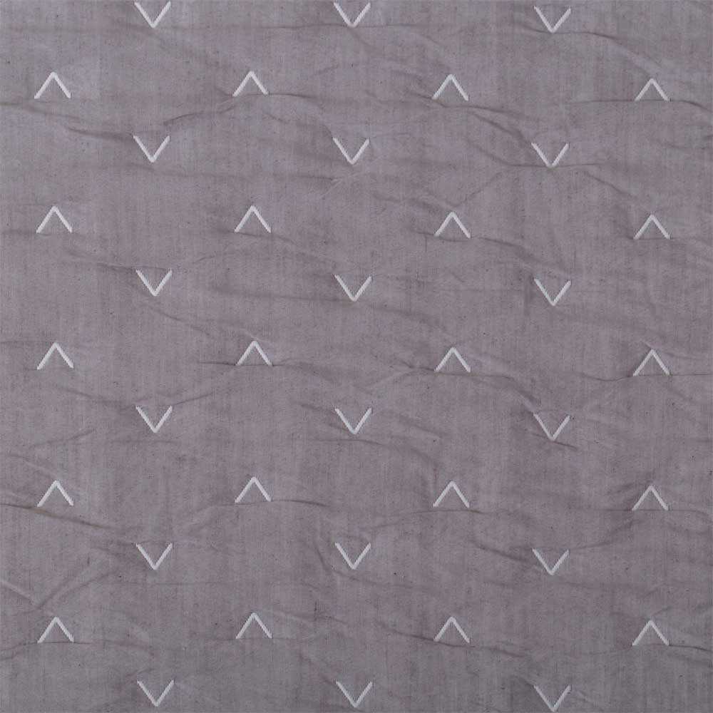 Colcha reversible gris de fácil mantenimiento con acolchado fino y confortable.