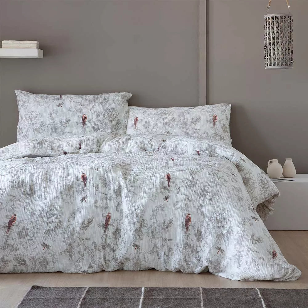 Funda nórdica de doble gasa de algodón prelavado blanco con textura natural y tacto extra suave.