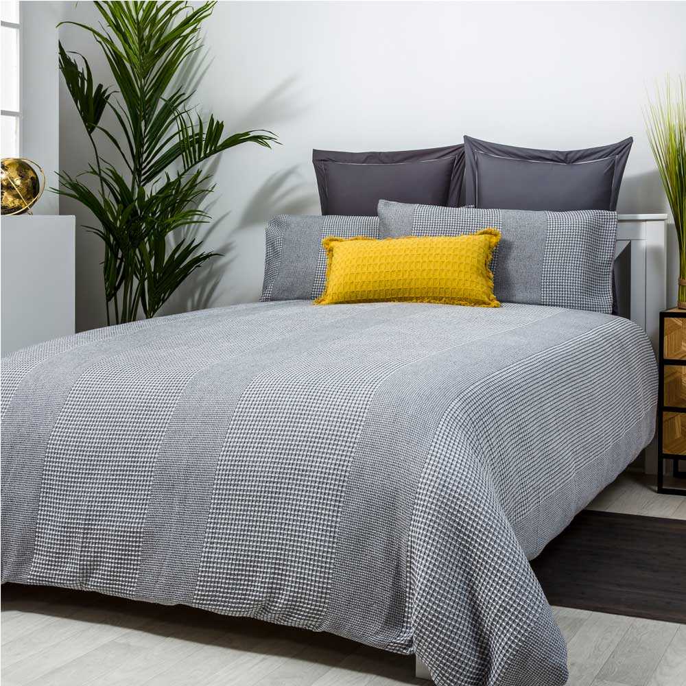 Funda nórdica de algodón color GRIS con textura nido de abeja para un dormitorio elegante.