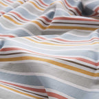 Sábanas infantiles de algodón percal multicolor, con colores vivos y tacto suave para crear un ambiente alegre en el dormitorio.
